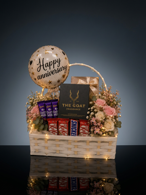 Anniversary gift box by The Goat Fragrance, perfume gift with chocolates, flowers and balloon hamper