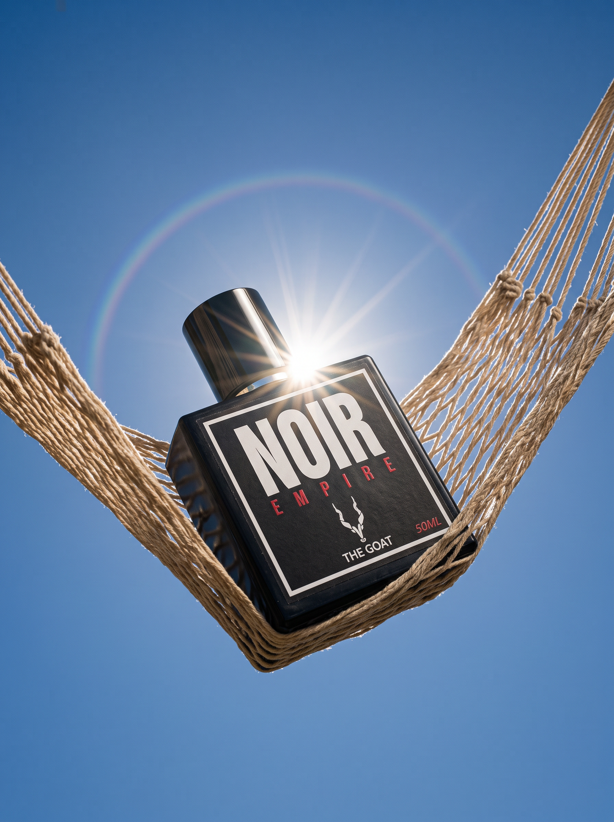 Close up of a woman holding Noir Empire perfume by The Goat Fragrance